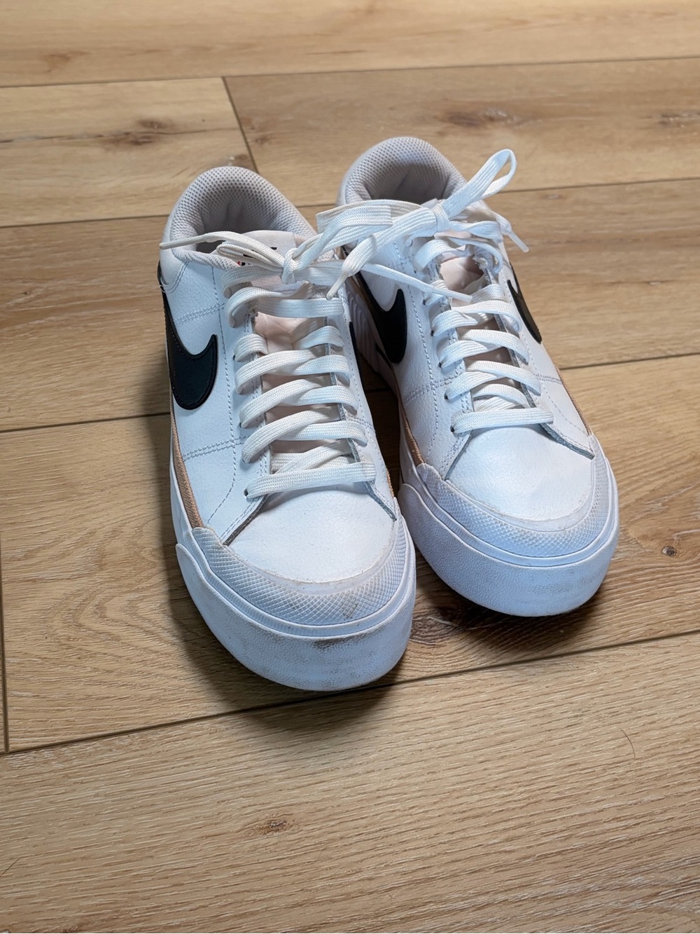 Nike White Leather Low-Top Sneakers with Black Swoosh and Tan Accent